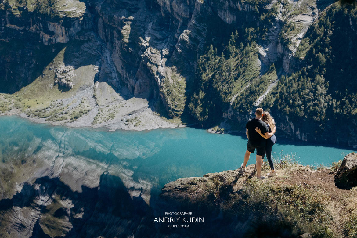 Oeschinensee engagement photos with turquoise lake and Swiss Alps