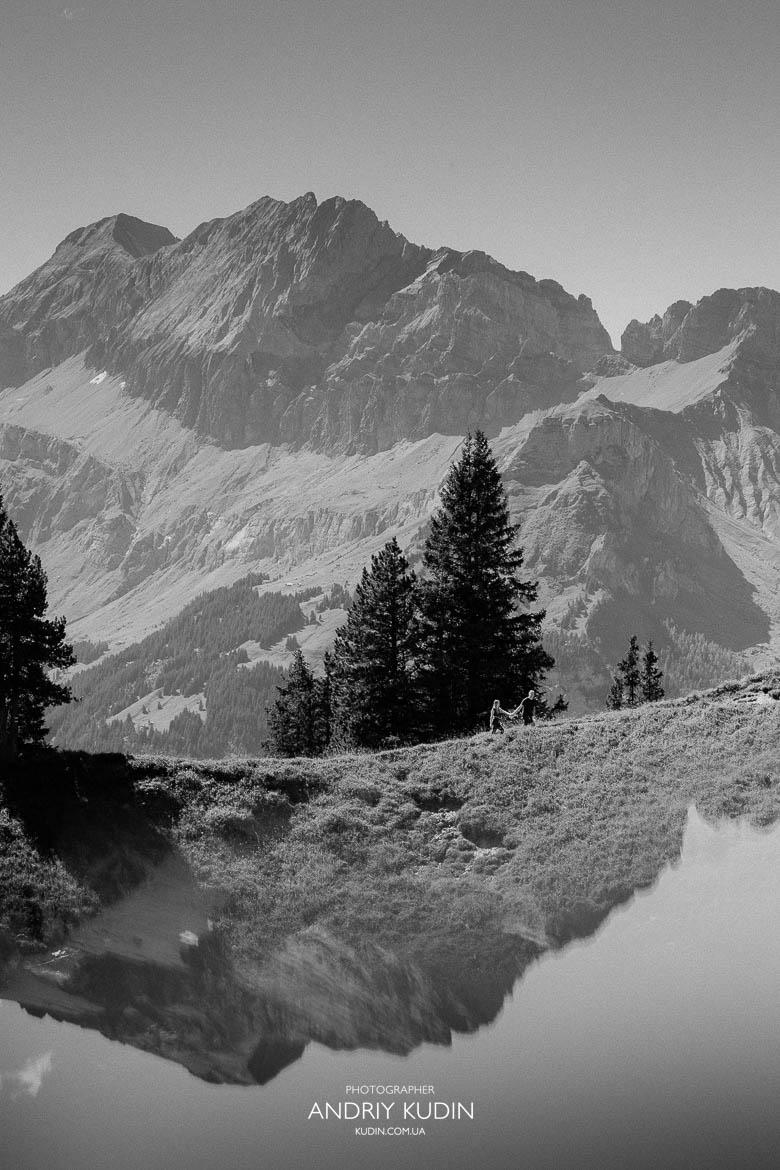 Couple hugging after engagement at Oeschinensee mountain lake