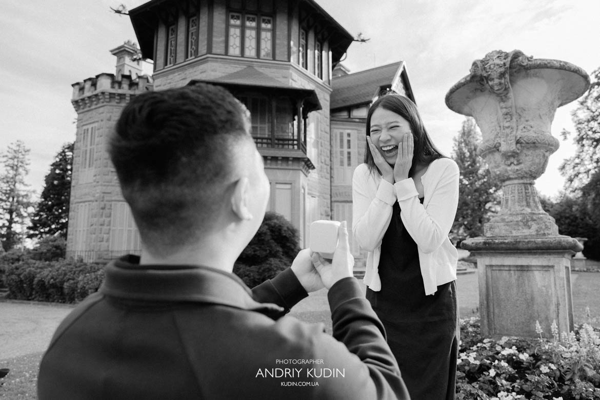 Candid moment of a man dropping to one knee for a secret proposal above Lake Lucerne. Candid moment of a man dropping to one knee for a secret proposal above Lake Lucerne.