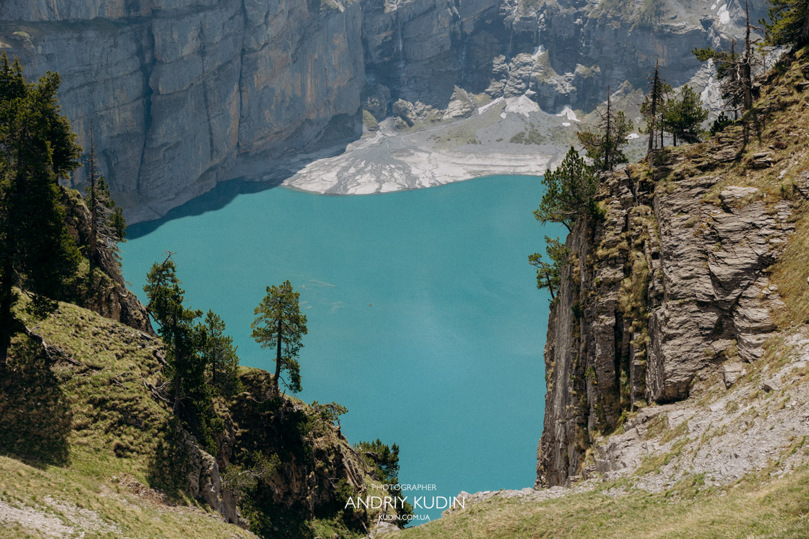 Best places to propose in Switzerland featuring a romantic couple at Oeschinen Lake.