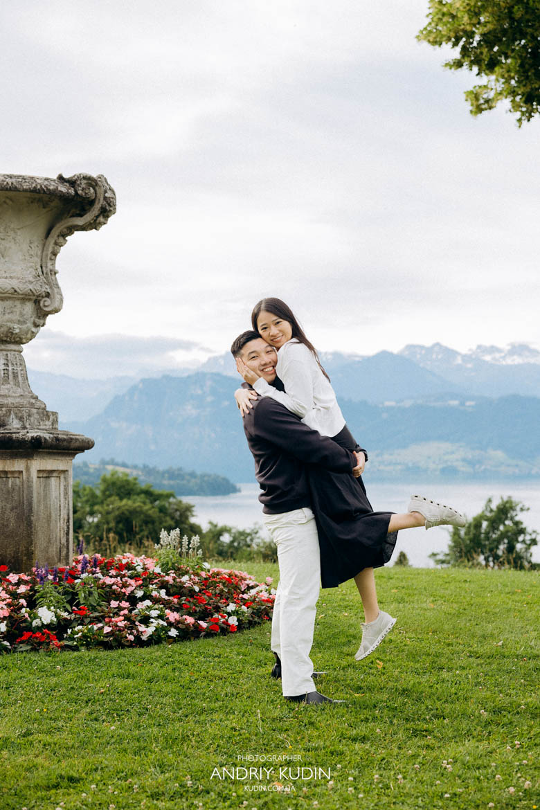 Joyful couple celebrating their engagement on an empty viewing platform in Central Switzerland. Joyful couple celebrating their engagement on an empty viewing platform in Central Switzerland.