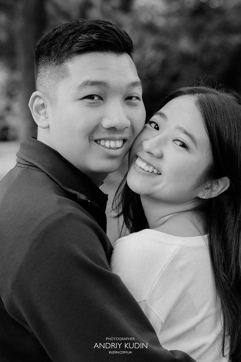 Wide smile of a bride-to-be as her partner tells the story of planning the surprise.