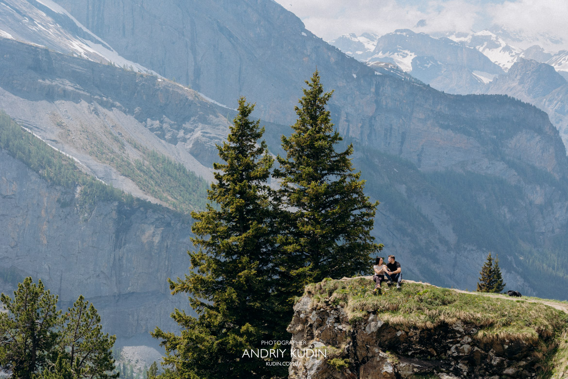 Best places to propose in Switzerland featuring a romantic couple at Oeschinen Lake.
