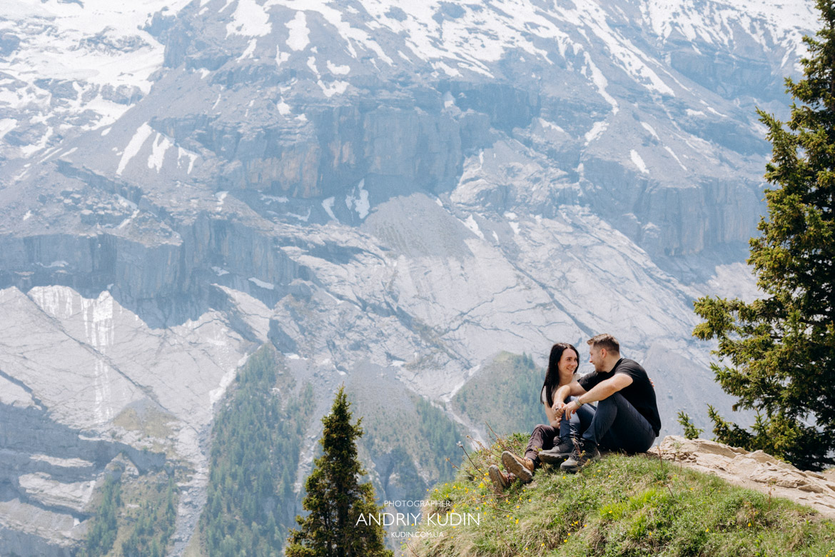Warm and emotional embrace between a couple after a successful surprise proposal Swiss Alps session.