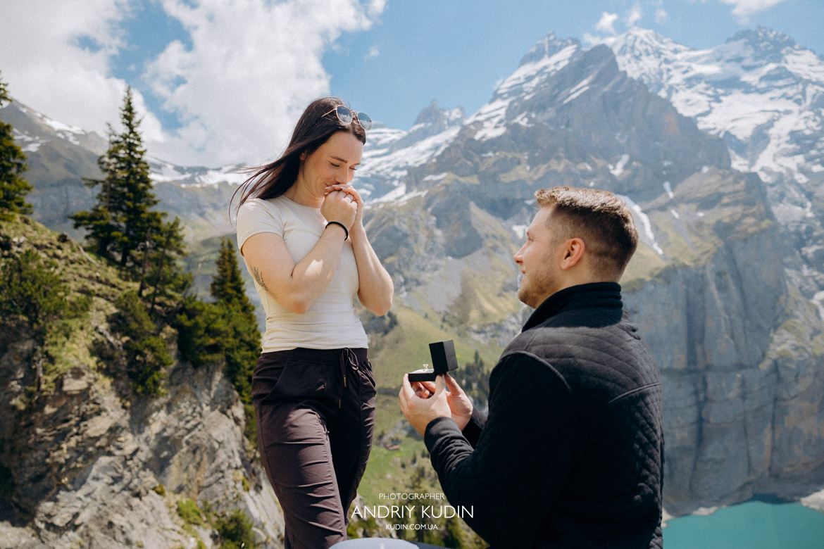 Man kneeling for an Oeschinensee proposal in May with perfect morning light.