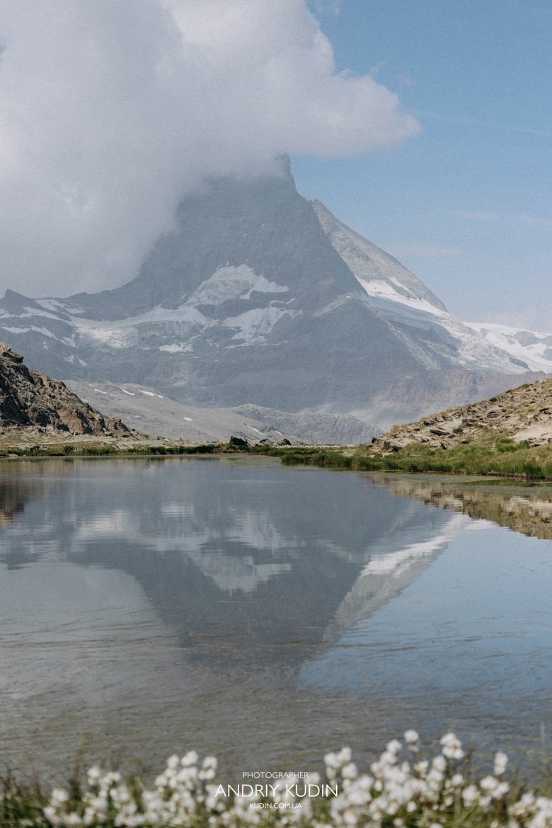 The mirror-like surface of Lake Riffelsee perfectly captures the Matterhorn The mirror-like surface of Lake Riffelsee perfectly captures the Matterhorn, Engagement photographer Zermatt photographing elegant couples.
