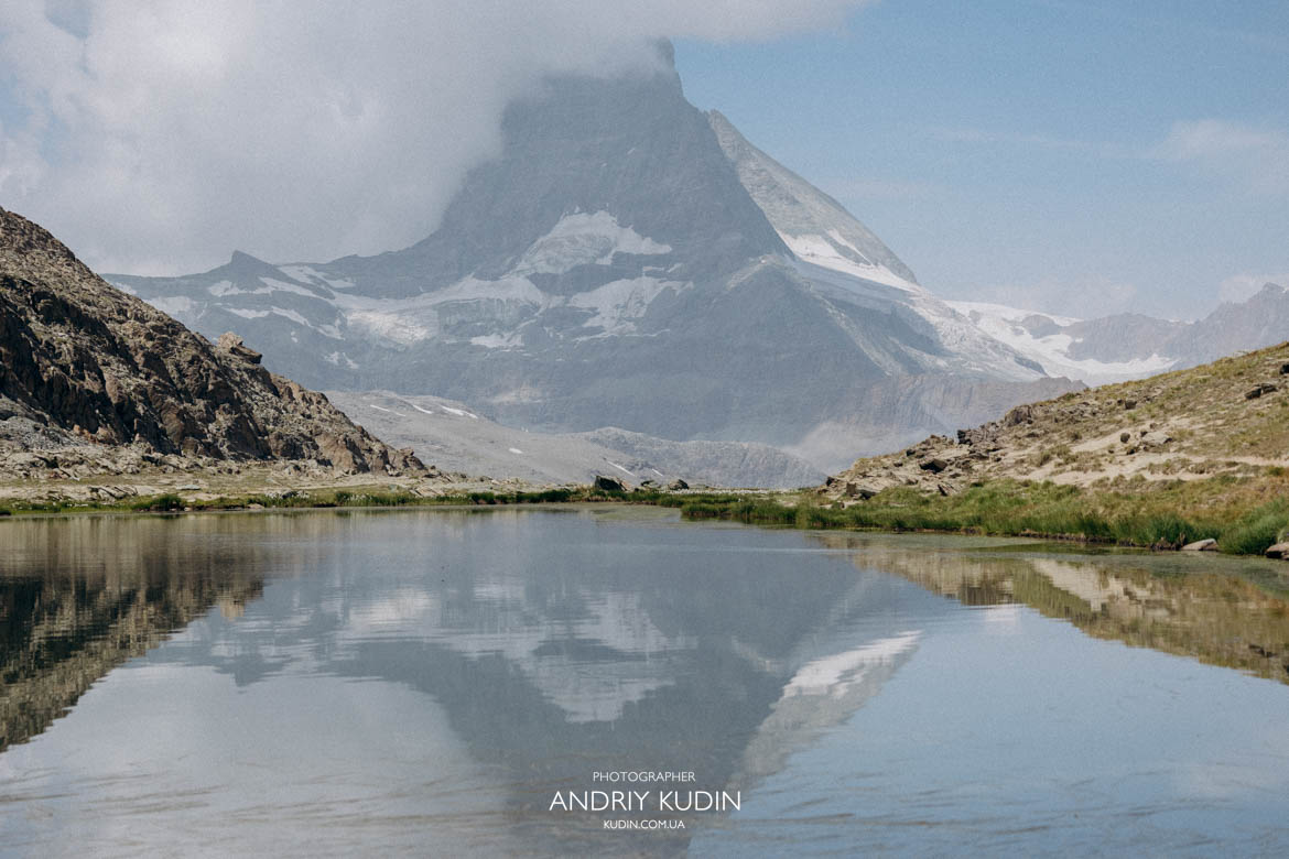 The mirror-like surface of Lake Riffelsee perfectly captures the Matterhorn The mirror-like surface of Lake Riffelsee perfectly captures the Matterhorn