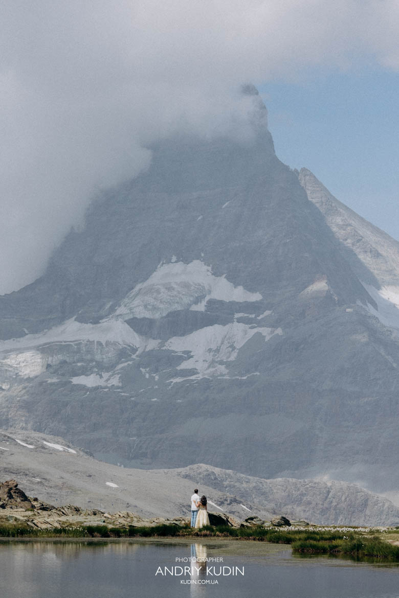 Surprise proposal photographer Zermatt photographing a couple by Riffelsee.Secret proposal planner Zermatt helping create a surprise engagement.