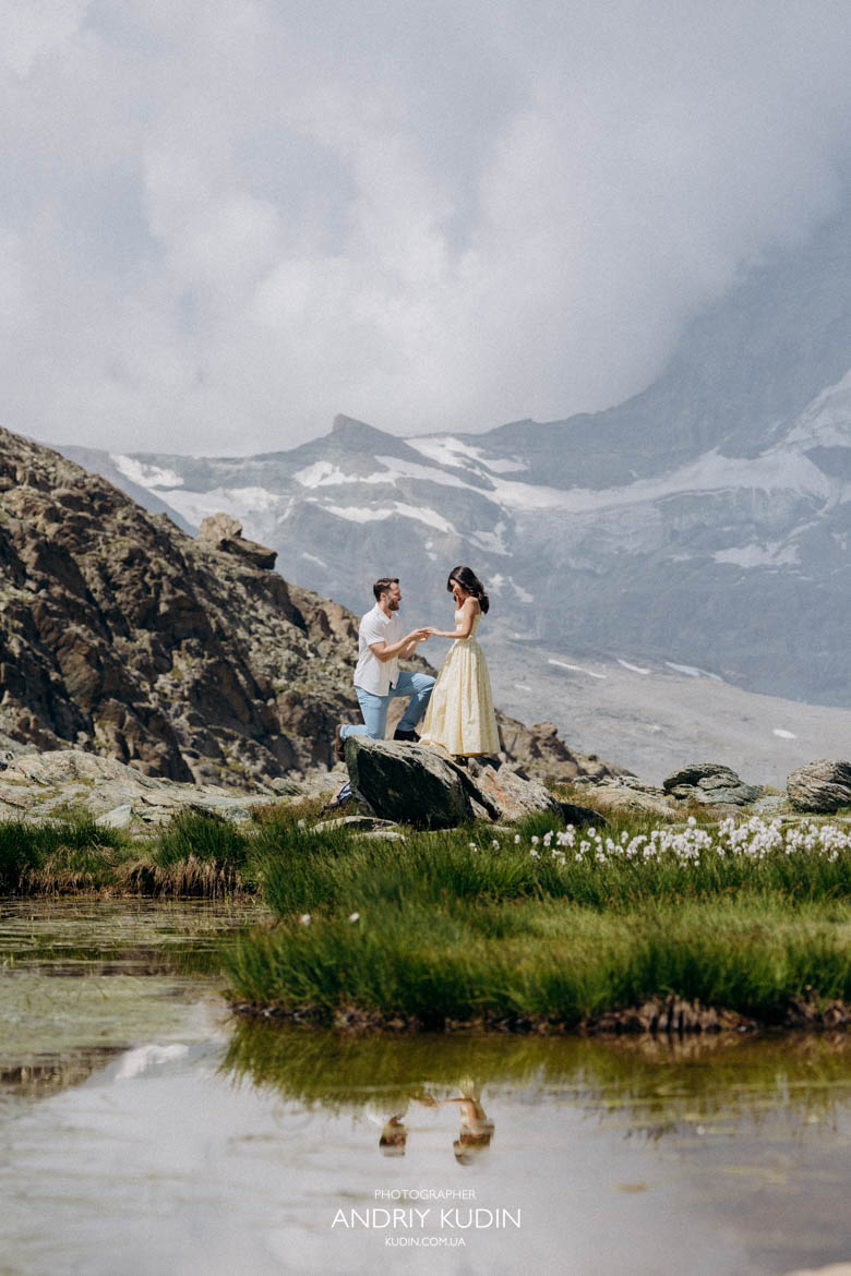 Switzerland photographer capturing a romantic Swiss Alps proposal. Switzerland photographer capturing a romantic Swiss Alps proposal. Proposal photographer Zermatt photographing a couple above the clouds.