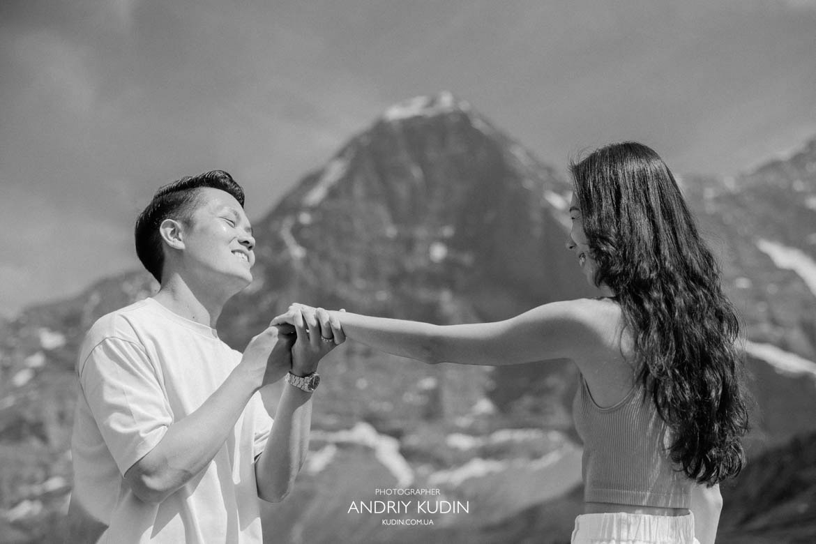 Swiss Alps proposal with lush alpine meadows. Switzerland proposal photographer capturing romantic mountain portraits.