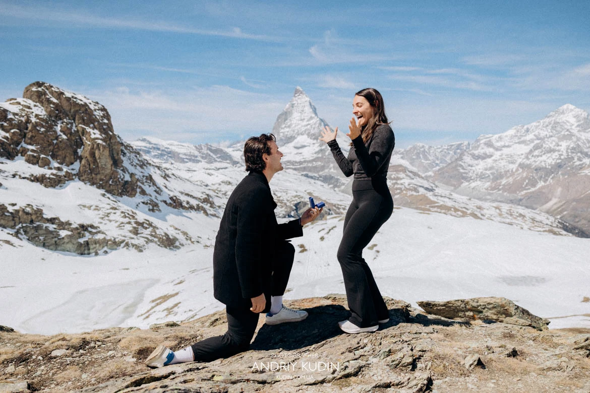 Photoshoot in Zermatt mountains during golden morning light. Matterhorn proposal photographer capturing the engagement ring moment.