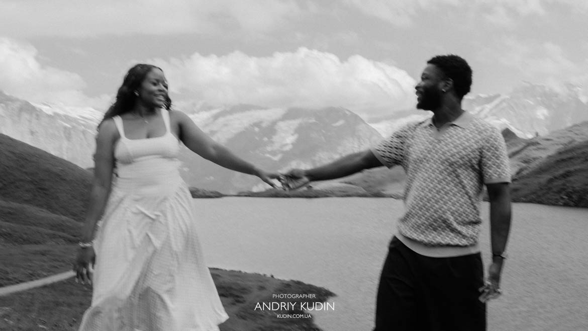 Bachalpsee engagement session Romantic couple laughing during an engagement session at Bachalpsee Grindelwald by switzerland proposal photographer